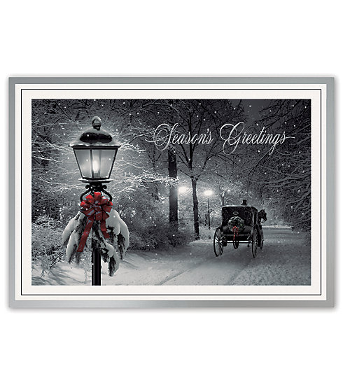 An inviting lamplight with horse and carriage adorn this card.