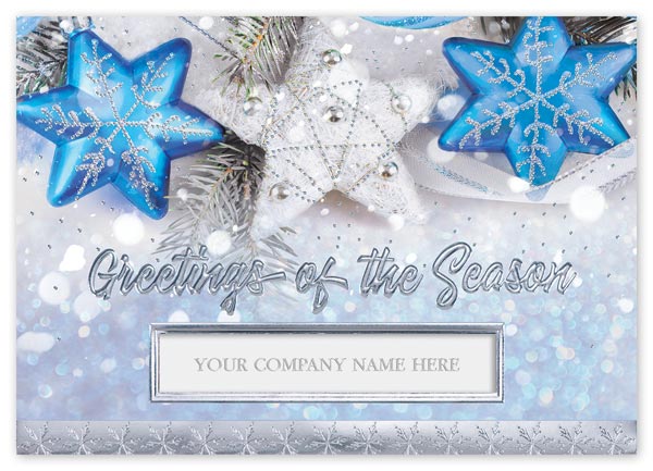 Vintage ornaments wink and shine on the Blue Star Magic holiday card.