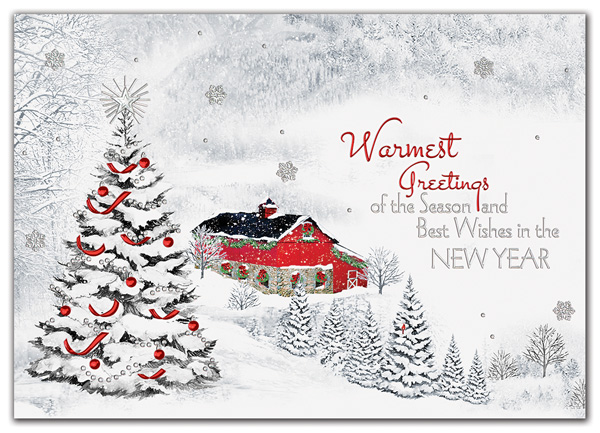 A beribboned tree and classic red barn bring holiday magic to a snowy valley in the Settled In Holiday Card.