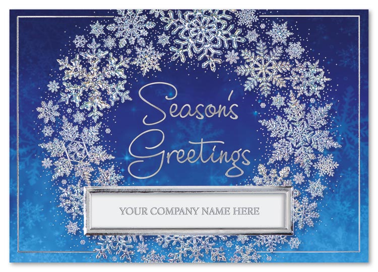 An artful wreath of shimmering snowflakes frames your holiday wish and company name in the Arctic Circle Holiday Card.