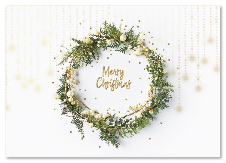 A wreath of greens and white berries in the Sweet Green Wreath Holiday Card is delicate enough to crown an angel.