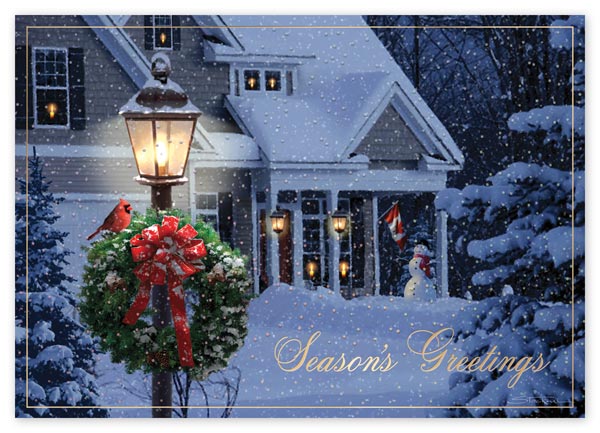 Beautiful scenery of a traditional home covered in snow and featuring a Canadian flag in the background.