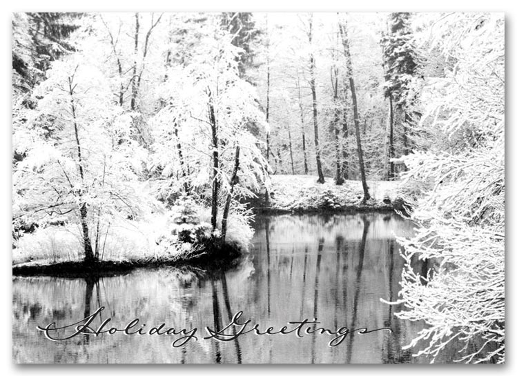 Winter holiday card showing a river surrounded by snow-covered trees.